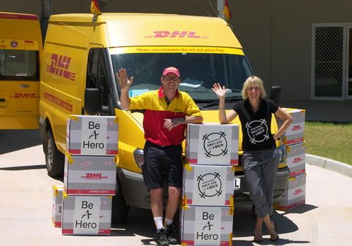 community IT program and DHL truck. isonic cares about global communities. iSonic Web Design and Digital Marketing, Cleveland, Brisbane